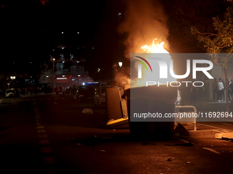 Several Valencia CF ultras confront the police by throwing objects and burning rubbish containers after losing against UD Las Palmas in a La...