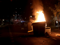 Several Valencia CF ultras confront the police by throwing objects and burning rubbish containers after losing against UD Las Palmas in a La...