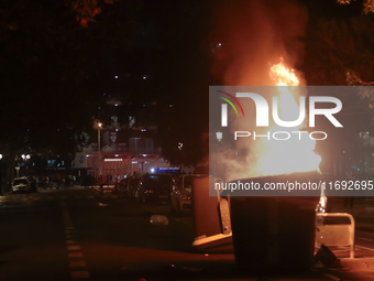 Several Valencia CF ultras confront the police by throwing objects and burning rubbish containers after losing against UD Las Palmas in a La...