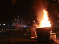 Several Valencia CF ultras confront the police by throwing objects and burning rubbish containers after losing against UD Las Palmas in a La...