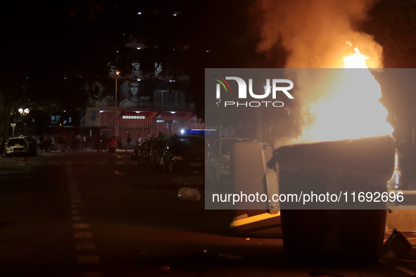 Several Valencia CF ultras confront the police by throwing objects and burning rubbish containers after losing against UD Las Palmas in a La...