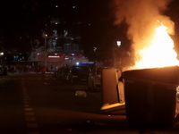 Several Valencia CF ultras confront the police by throwing objects and burning rubbish containers after losing against UD Las Palmas in a La...