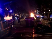 Several Valencia CF ultras confront the police by throwing objects and burning rubbish containers after losing against UD Las Palmas in a La...