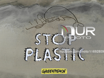 Greenpeace volunteers work on the beach with the students of the Fermi-Nervi-Cassandro Institute to say stop to single-use plastic in Barlet...