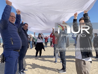 Greenpeace volunteers work on the beach with the students of the Fermi-Nervi-Cassandro Institute to say stop to single-use plastic in Barlet...