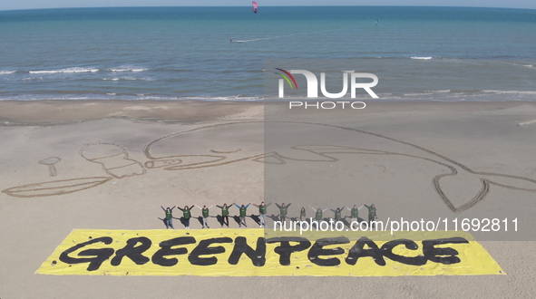 Greenpeace volunteers work on the beach with the students of the Fermi-Nervi-Cassandro Institute to say stop to single-use plastic in Barlet...