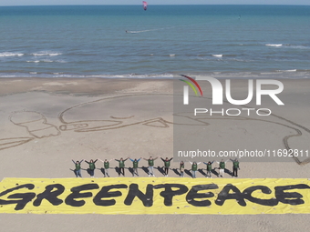 Greenpeace volunteers work on the beach with the students of the Fermi-Nervi-Cassandro Institute to say stop to single-use plastic in Barlet...