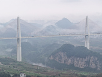 A photo taken on October 22, 2024, shows the scenery of Malinghe River Bridge in Xingyi, China, on October 22, 2024. (