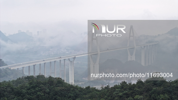 A photo taken on October 22, 2024, shows the scenery of Malinghe River Bridge in Xingyi, China, on October 22, 2024. 