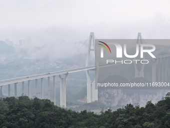 A photo taken on October 22, 2024, shows the scenery of Malinghe River Bridge in Xingyi, China, on October 22, 2024. (