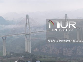 A photo taken on October 22, 2024, shows the scenery of Malinghe River Bridge in Xingyi, China, on October 22, 2024. (