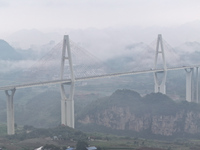 A photo taken on October 22, 2024, shows the scenery of Malinghe River Bridge in Xingyi, China, on October 22, 2024. (