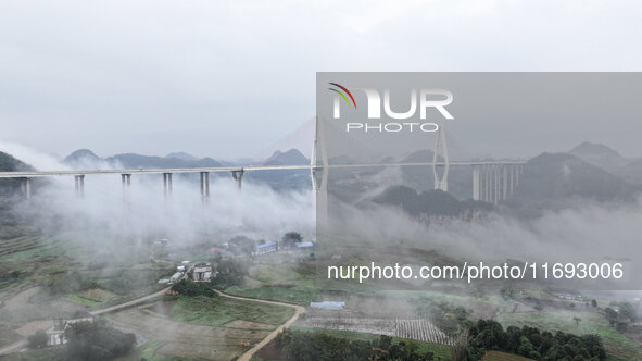 A photo taken on October 22, 2024, shows the scenery of Malinghe River Bridge in Xingyi, China, on October 22, 2024. 