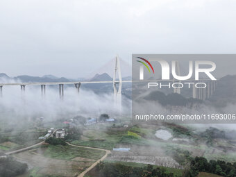 A photo taken on October 22, 2024, shows the scenery of Malinghe River Bridge in Xingyi, China, on October 22, 2024. (