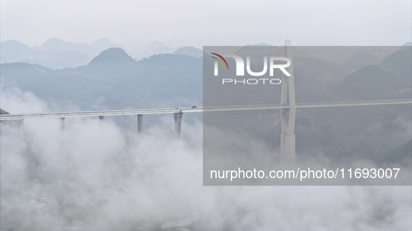 A photo taken on October 22, 2024, shows the scenery of Malinghe River Bridge in Xingyi, China, on October 22, 2024. 