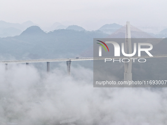 A photo taken on October 22, 2024, shows the scenery of Malinghe River Bridge in Xingyi, China, on October 22, 2024. (