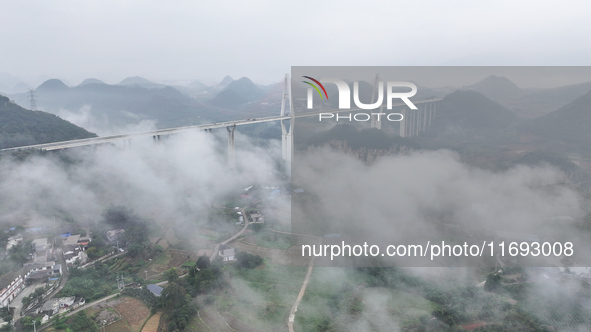 A photo taken on October 22, 2024, shows the scenery of Malinghe River Bridge in Xingyi, China, on October 22, 2024. 