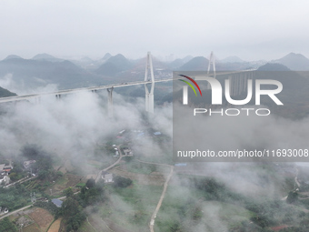 A photo taken on October 22, 2024, shows the scenery of Malinghe River Bridge in Xingyi, China, on October 22, 2024. (