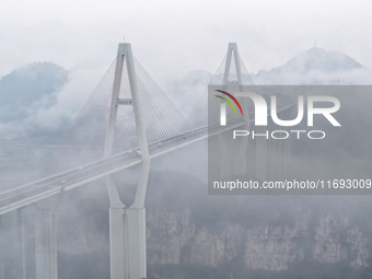 A photo taken on October 22, 2024, shows the scenery of Malinghe River Bridge in Xingyi, China, on October 22, 2024. (