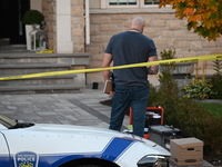 Investigators from the Peel Regional Police search for evidence at the scene of a home invasion in Brampton, Canada, on October 21, 2024. On...