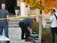 Investigators from the Peel Regional Police search for evidence at the scene of a home invasion in Brampton, Canada, on October 21, 2024. On...