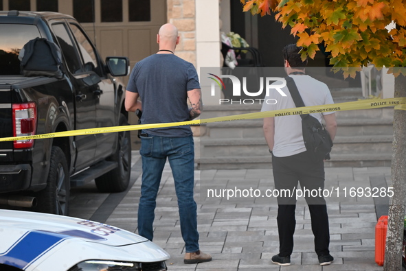 Investigators from the Peel Regional Police search for evidence at the scene of a home invasion in Brampton, Canada, on October 21, 2024. On...