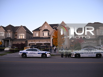 Investigators from the Peel Regional Police search for evidence at the scene of a home invasion in Brampton, Canada, on October 21, 2024. On...