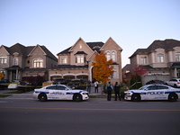 Investigators from the Peel Regional Police search for evidence at the scene of a home invasion in Brampton, Canada, on October 21, 2024. On...