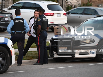 Investigators from the Peel Regional Police search for evidence at the scene of a home invasion in Brampton, Canada, on October 21, 2024. On...