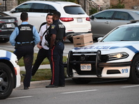 Investigators from the Peel Regional Police search for evidence at the scene of a home invasion in Brampton, Canada, on October 21, 2024. On...