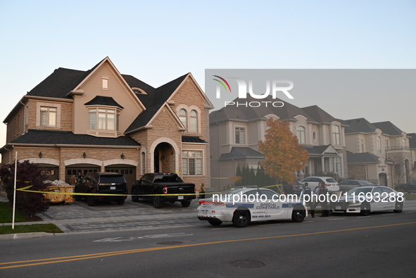 Investigators from the Peel Regional Police search for evidence at the scene of a home invasion in Brampton, Canada, on October 21, 2024. On...