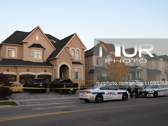 Investigators from the Peel Regional Police search for evidence at the scene of a home invasion in Brampton, Canada, on October 21, 2024. On...