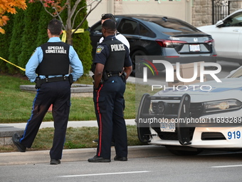 Investigators from the Peel Regional Police search for evidence at the scene of a home invasion in Brampton, Canada, on October 21, 2024. On...