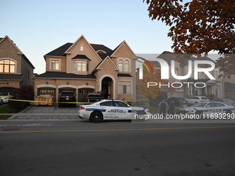 Investigators from the Peel Regional Police search for evidence at the scene of a home invasion in Brampton, Canada, on October 21, 2024. On...