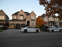 Investigators from the Peel Regional Police search for evidence at the scene of a home invasion in Brampton, Canada, on October 21, 2024. On...