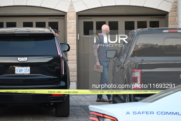 Investigators from the Peel Regional Police search for evidence at the scene of a home invasion in Brampton, Canada, on October 21, 2024. On...