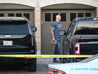 Investigators from the Peel Regional Police search for evidence at the scene of a home invasion in Brampton, Canada, on October 21, 2024. On...