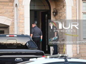 Investigators from the Peel Regional Police search for evidence at the scene of a home invasion in Brampton, Canada, on October 21, 2024. On...