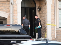 Investigators from the Peel Regional Police search for evidence at the scene of a home invasion in Brampton, Canada, on October 21, 2024. On...