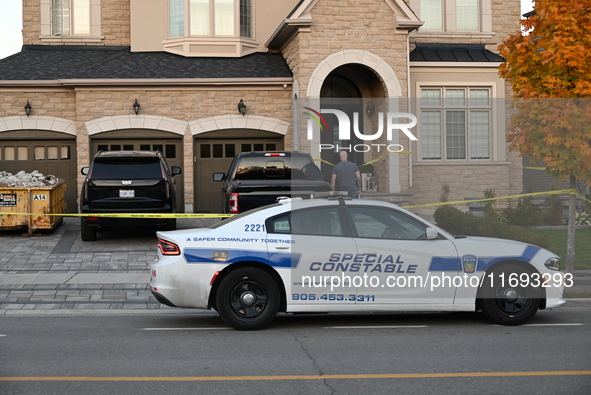 Investigators from the Peel Regional Police search for evidence at the scene of a home invasion in Brampton, Canada, on October 21, 2024. On...