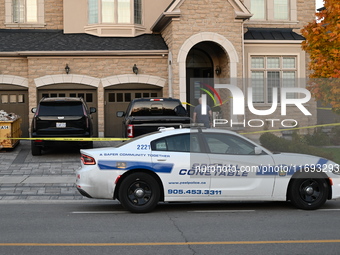 Investigators from the Peel Regional Police search for evidence at the scene of a home invasion in Brampton, Canada, on October 21, 2024. On...