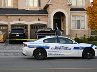 Investigators from the Peel Regional Police search for evidence at the scene of a home invasion in Brampton, Canada, on October 21, 2024. On...