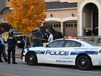 Investigators from the Peel Regional Police search for evidence at the scene of a home invasion in Brampton, Canada, on October 21, 2024. On...