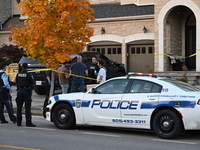 Investigators from the Peel Regional Police search for evidence at the scene of a home invasion in Brampton, Canada, on October 21, 2024. On...