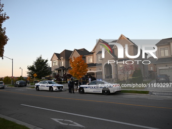 Investigators from the Peel Regional Police search for evidence at the scene of a home invasion in Brampton, Canada, on October 21, 2024. On...