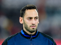 Hakan Calhanoglu of FC Internazionale looks on during the Serie A Enilive match between AS Roma and FC Internazionale at Stadio Olimpico on...