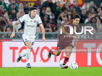 Paulo Dybala of AS Roma and Alessandro Bastoni of FC Internazionale during the Serie A Enilive match between AS Roma and FC Internazionale a...