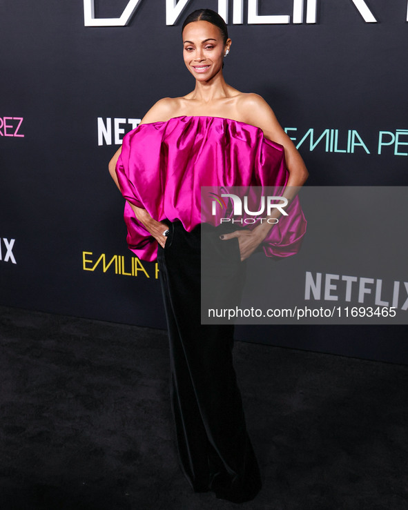 Zoe Saldana wearing a Saint Laurent dress arrives at the Los Angeles Premiere of Netflix's 'Emilia Perez' held at The Egyptian Theatre Holly...