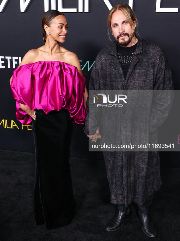 Zoe Saldana and husband Marco Perego-Saldana arrive at the Los Angeles Premiere of Netflix's 'Emilia Perez' held at The Egyptian Theatre Hol...