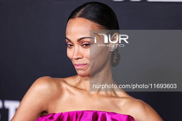 Zoe Saldana wearing a Saint Laurent dress arrives at the Los Angeles Premiere of Netflix's 'Emilia Perez' held at The Egyptian Theatre Holly...